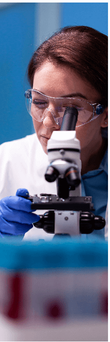 Person using a microscope in a laboratory